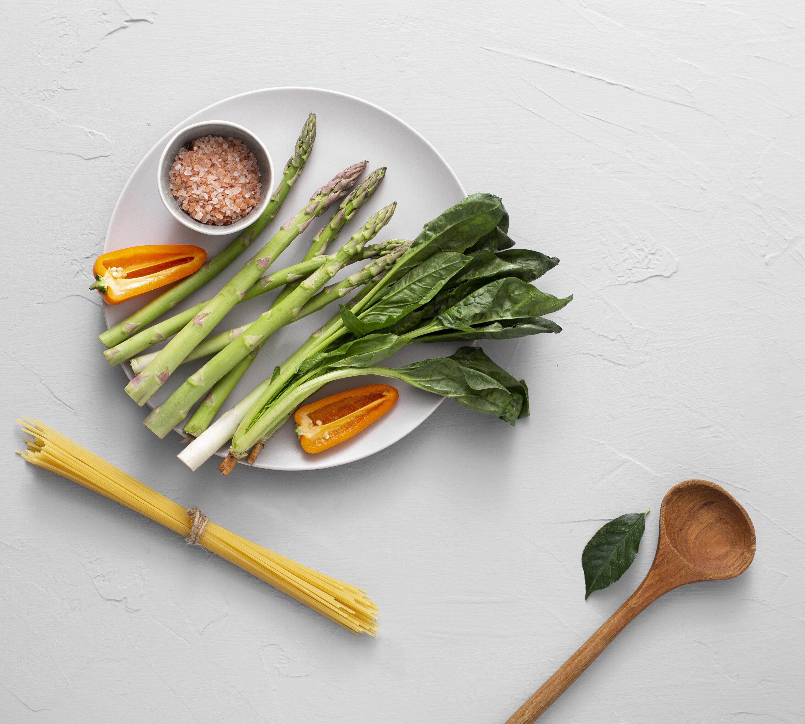 top-view-asparagus-plate-with-himalayan-salt-raw-spaghetti